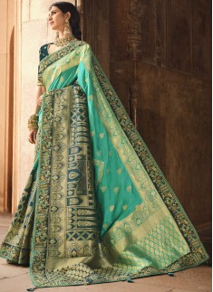 Stunning Banarasi Silk Fabric Saree With ontrast Heavy Work Blouse Piece