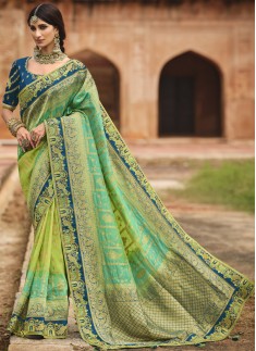 Stunning Banarasi Silk Fabric Saree With ontrast Heavy Work Blouse Piece