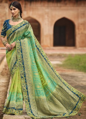 Stunning Banarasi Silk Fabric Saree With ontrast Heavy Work Blouse Piece