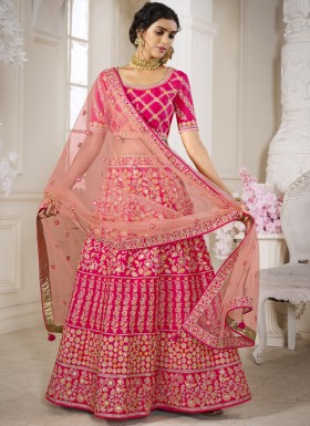 Traditional Silk Fabric Lehenga Choli With Decent Work And Net Dupatta